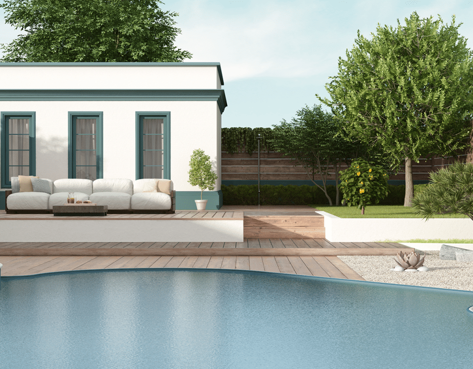 A modern home featuring a swimming pool and a spacious patio area, surrounded by greenery and outdoor furniture.