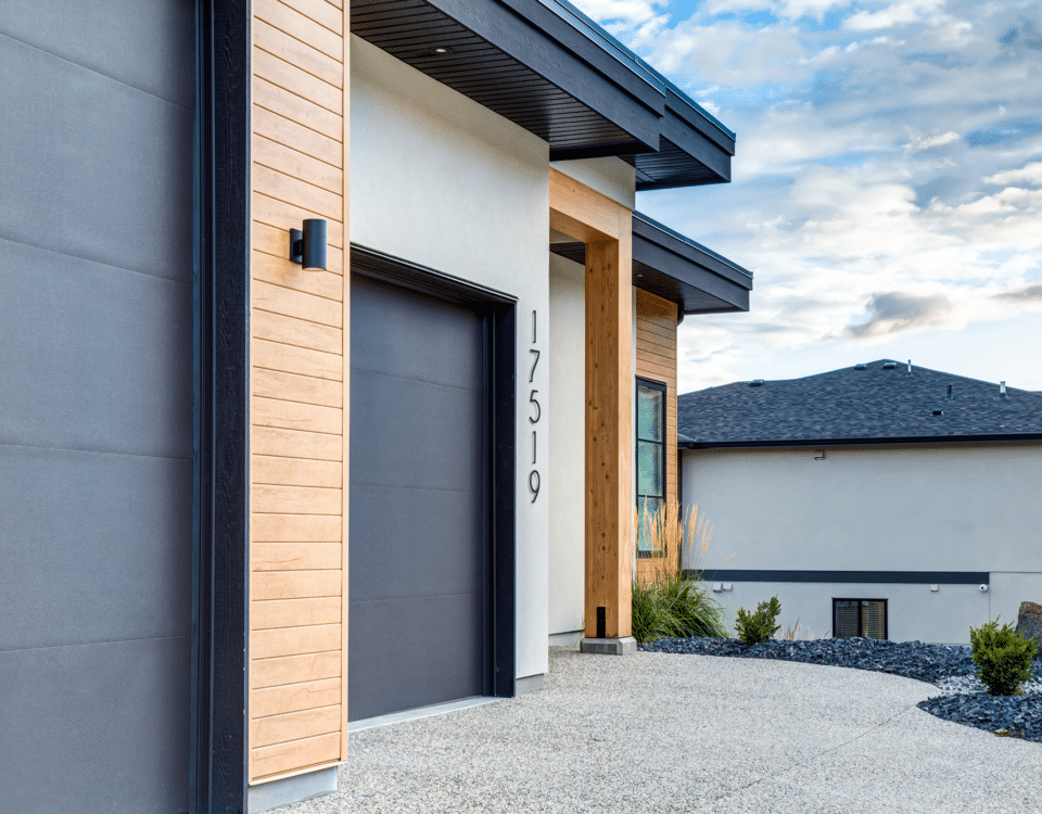 A contemporary house featuring a sleek garage door, showcasing modern architectural design and clean lines.