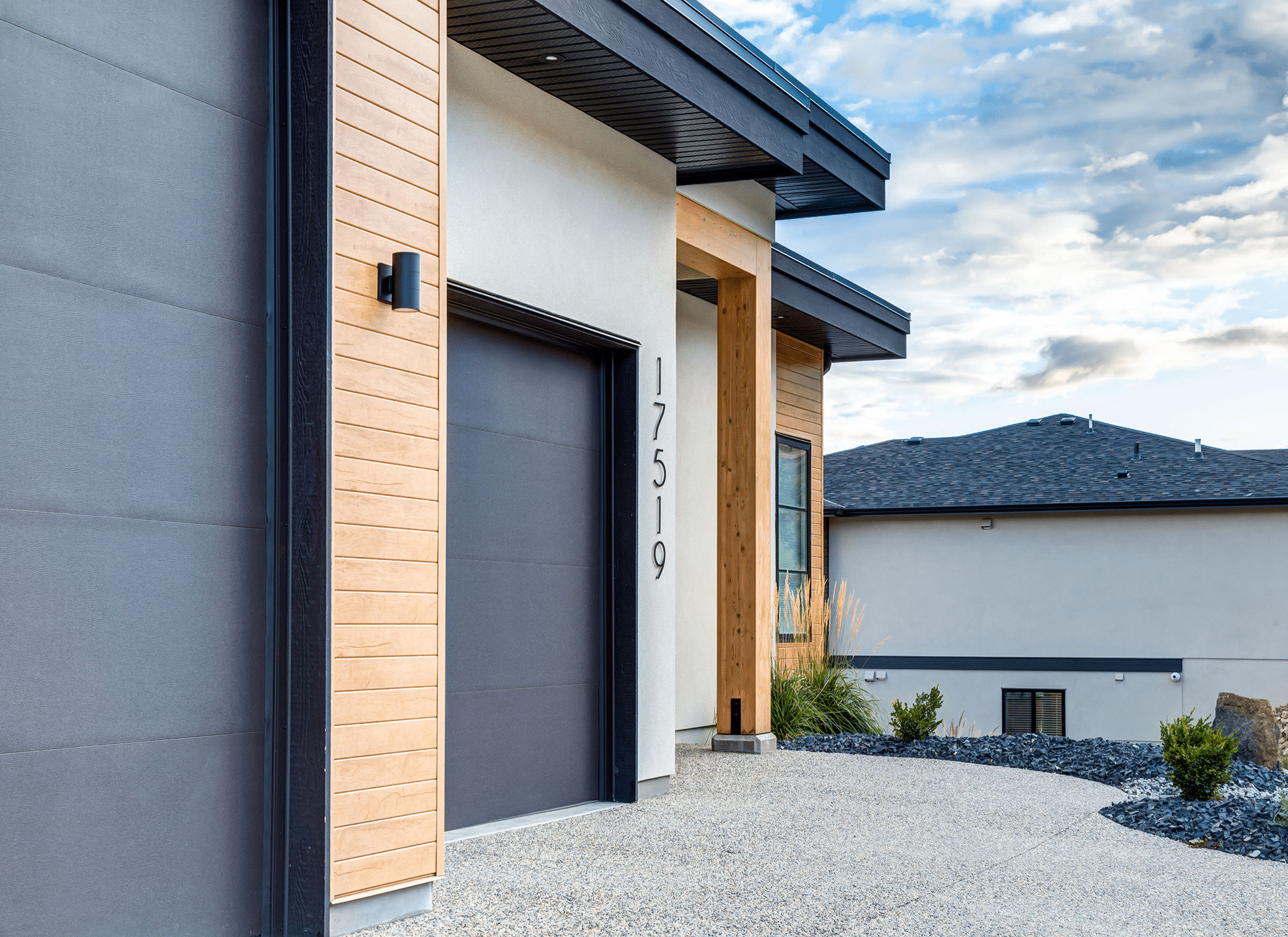 A contemporary house featuring a sleek garage door, showcasing modern architectural design and clean lines.