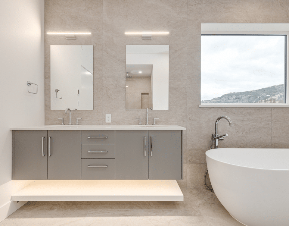 A spacious bathroom featuring a large bathtub and a modern sink, showcasing a clean and elegant design.