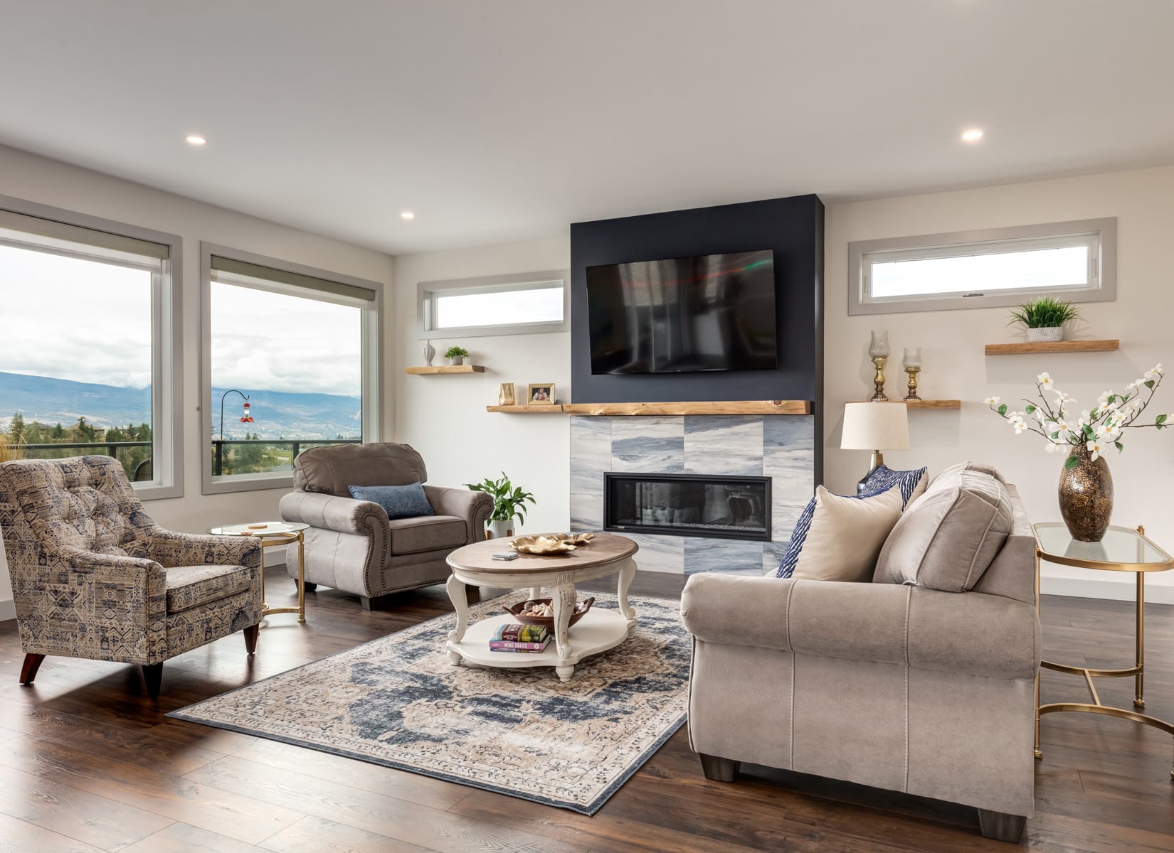 A cozy living room featuring a fireplace, comfortable couches, and a television, creating a warm and inviting atmosphere.